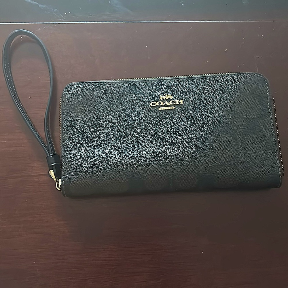 Coach zip around wallet. NWOT. Carried once.